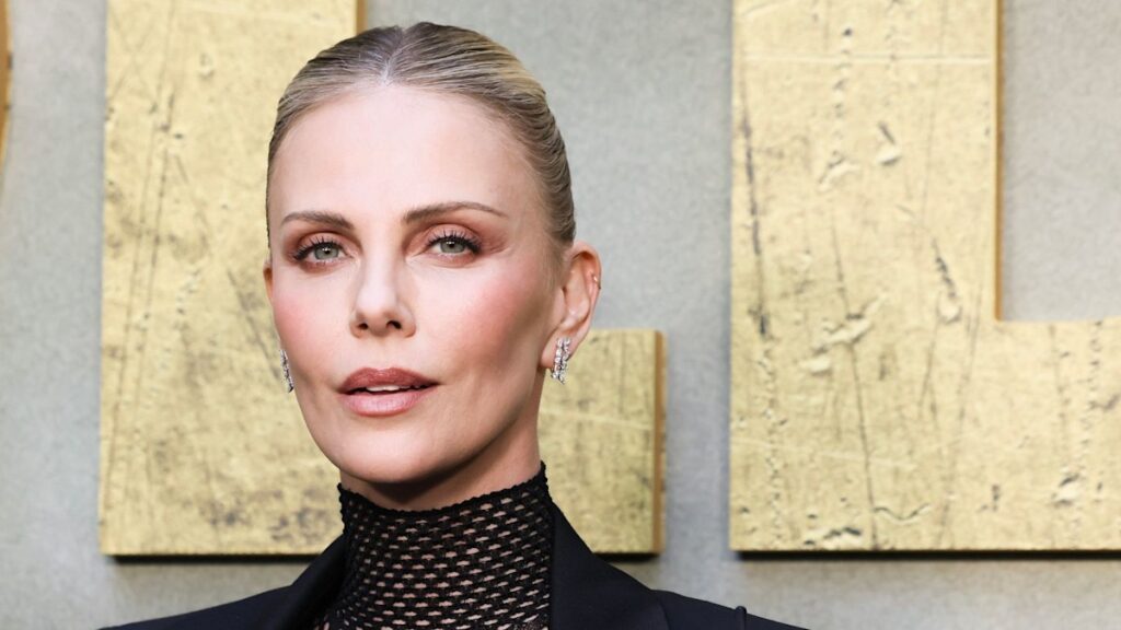 e1d91acad9f0gettyimages2222192624jpg | New Top Model Charlize Therons head to toe fishnets and no pants combo makes for show stopping display