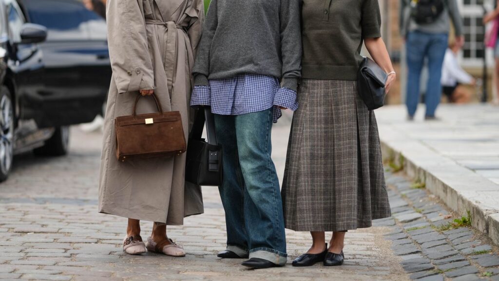 How to Wear Flat Shoes With Dresses Skirts and Jeans This Fall 2025