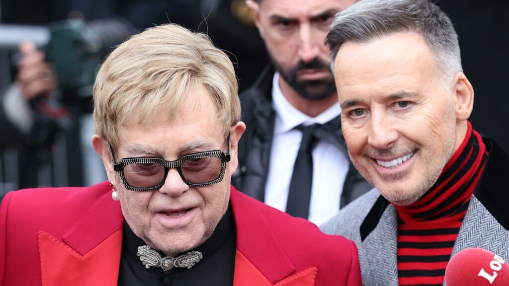 Sir Elton John and his husband of over 11 years David Furnish arrived in Paris for Paris Haute Couture Week and attended the Valentino runway show with a custom bag believed to be worth around £14k
