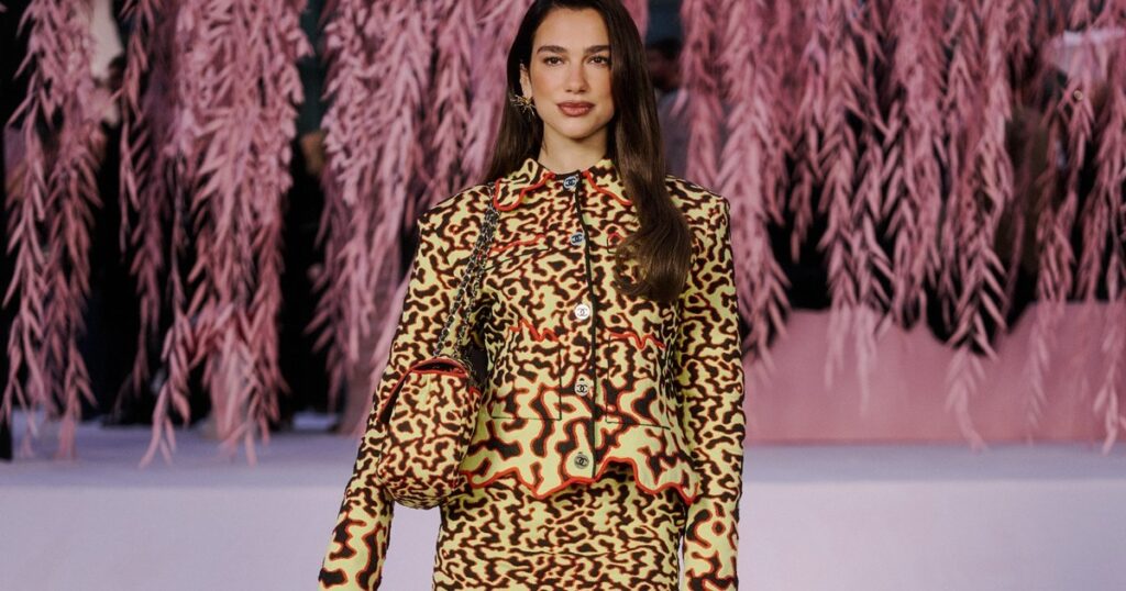 Dua Lipa Dazzles in Mid Skirt Ensemble For PFW