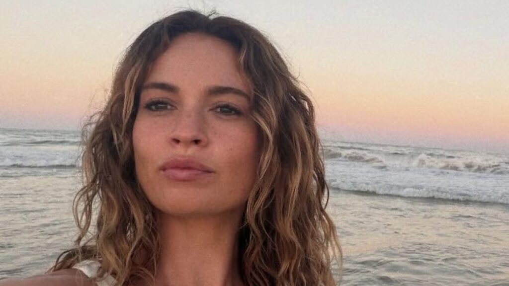 Lily James is the ultimate holiday bombshell in barely there bikini and sea drenched hair