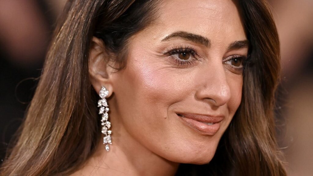 George Clooneys wife Amal is a 70s bombshell in leg lengthening jeans