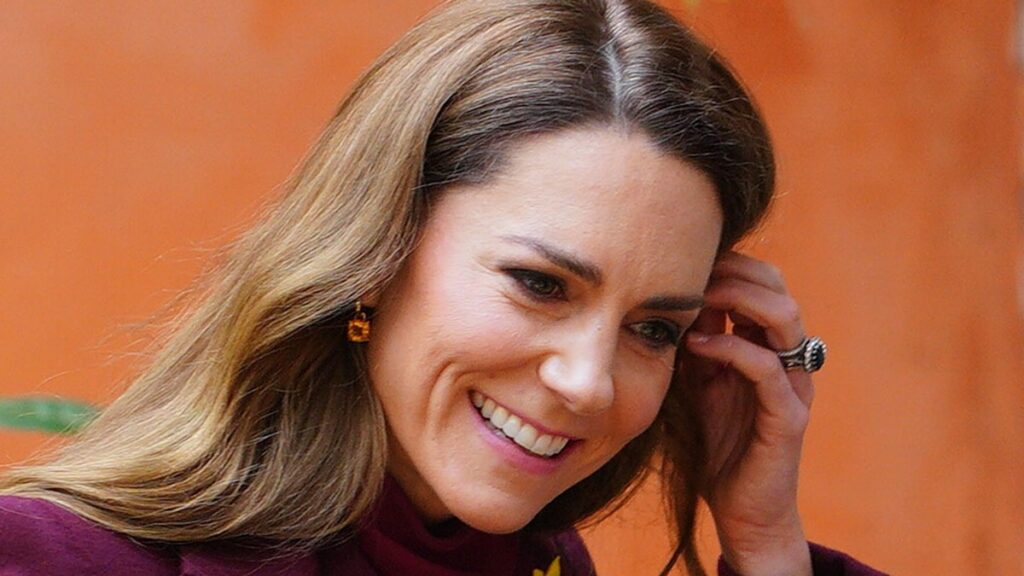 Kate Middleton turns heads in figure sculpting coat and knee high boots