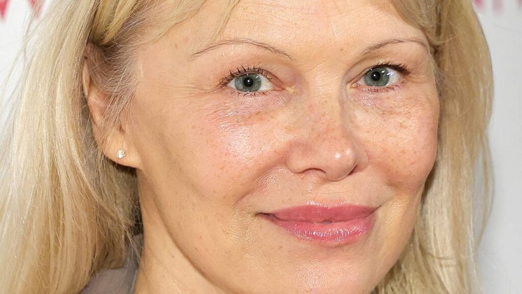 Pamela Anderson 58 looks younger than ever in knee high boots and zero makeup