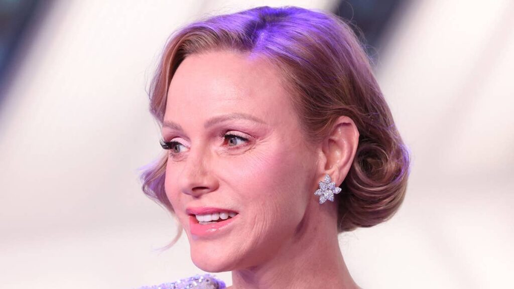 Princess Charlene looks sharp in towering Louis Vuitton heels and the £5k bag to match