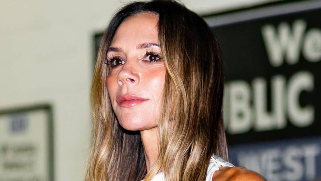 Victoria Beckhams daring jumpsuit has a midriff baring twist