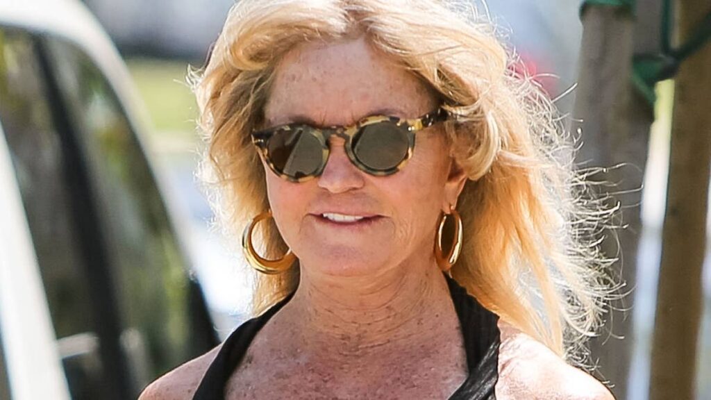 Sun kissed Goldie Hawn 80 looks phenomenal in low cut studded swimsuit in Greece