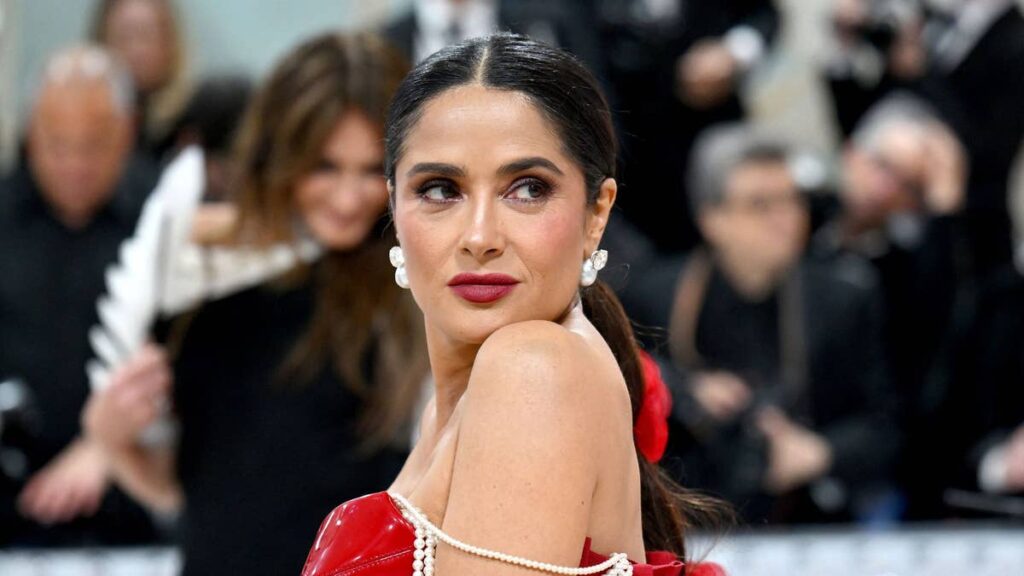 e6efc294ea6agettyimages1252513162jpg | New Top Model Salma Hayek turns heads in figure hugging power suit during surprise appearance at World Cup opening